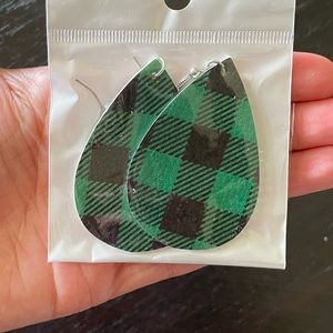 Never worn! Large green and black plaid teardrop leather earrings.